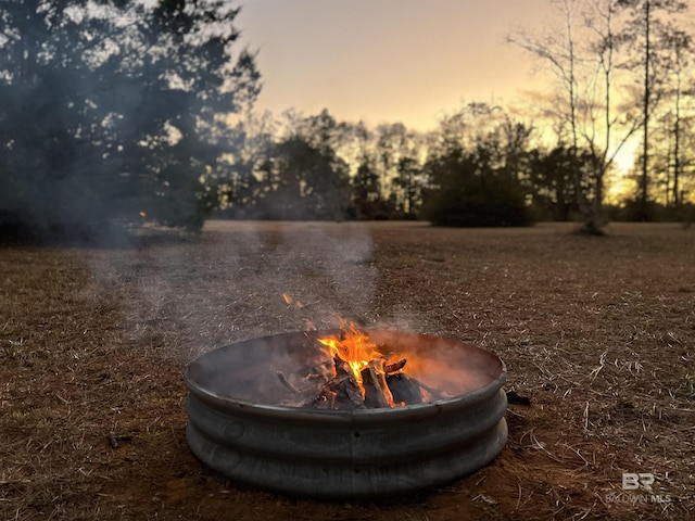 exterior space featuring an outdoor fire pit