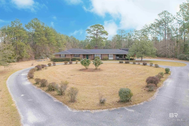 ranch-style house with curved driveway