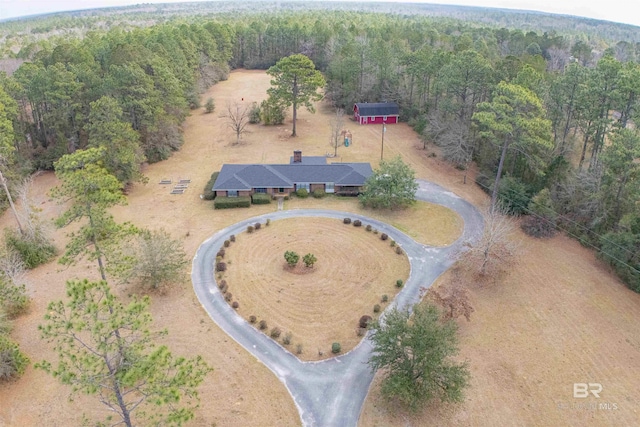 bird's eye view featuring a forest view