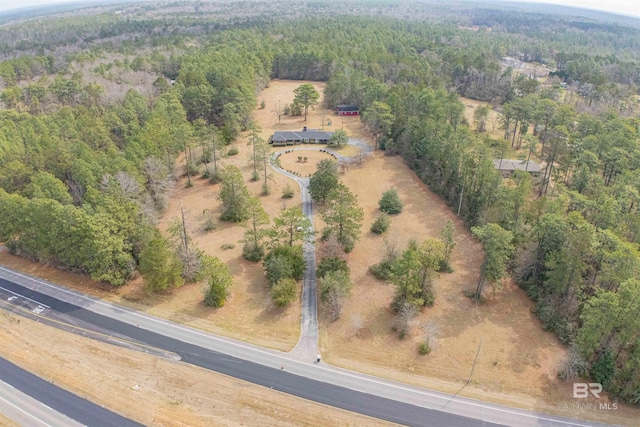 bird's eye view featuring a wooded view