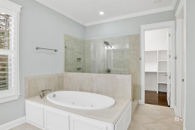 bathroom with crown molding, tile patterned floors, and separate shower and tub