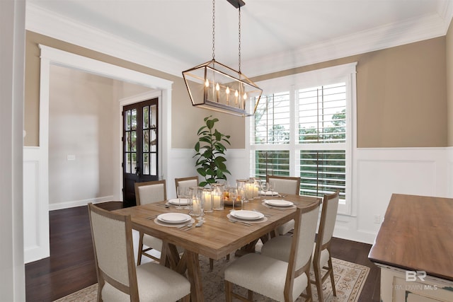 8624 N Lamhatty Ln, Daphne, AL 36526 - dining space with wainscoting, dark wood-type flooring, a chandelier, a decorative wall, and crown molding