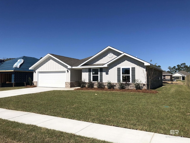 view of front of house with brick siding, board and batten siding, a garage, driveway, and a front lawn