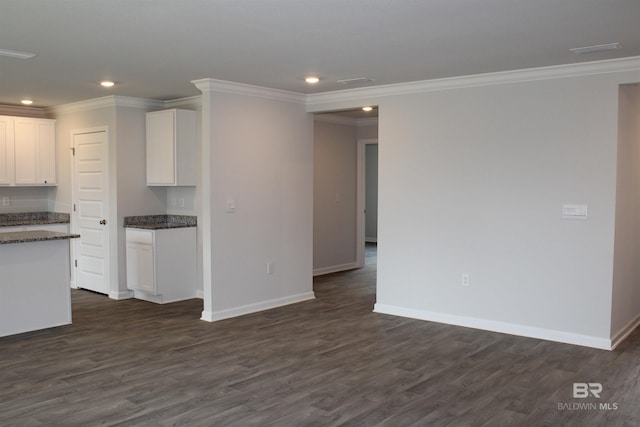 kitchen featuring baseboards, white cabinetry, dark wood-style flooring, and recessed lighting