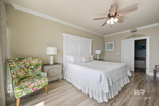 bedroom featuring light hardwood / wood-style floors, ornamental molding, and ceiling fan