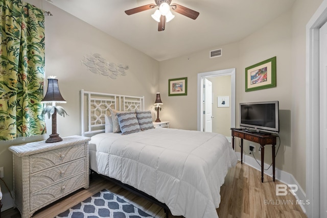 bedroom featuring ceiling fan and dark hardwood / wood-style floors