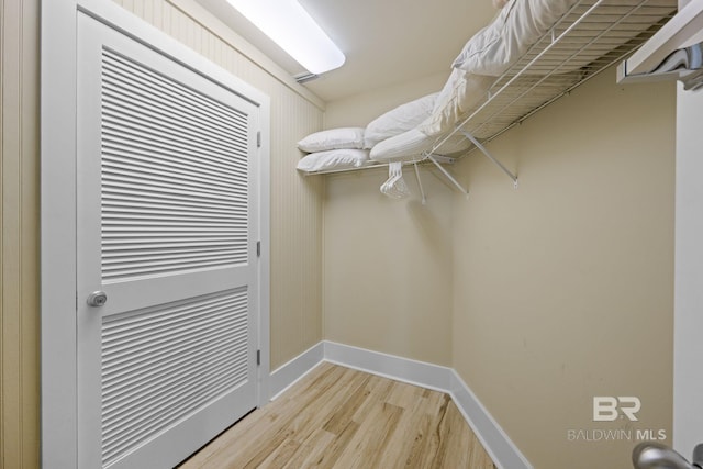 spacious closet featuring light hardwood / wood-style floors