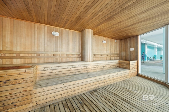 view of sauna featuring wood ceiling, wood walls, and hardwood / wood-style flooring