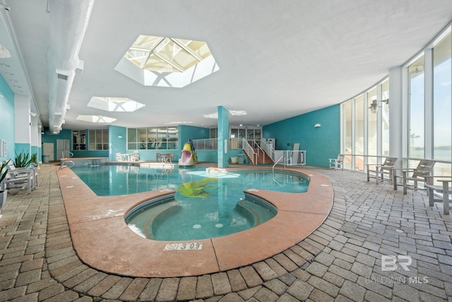 view of pool with a skylight