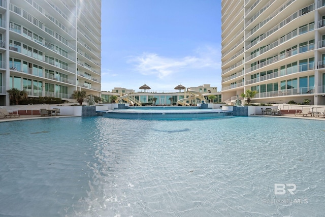 view of swimming pool featuring pool water feature