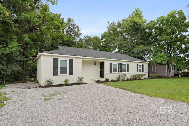 3512 Spring Hill Ave, Mobile, AL 36608 - ranch-style home with a front lawn, board and batten siding, driveway, and roof with shingles