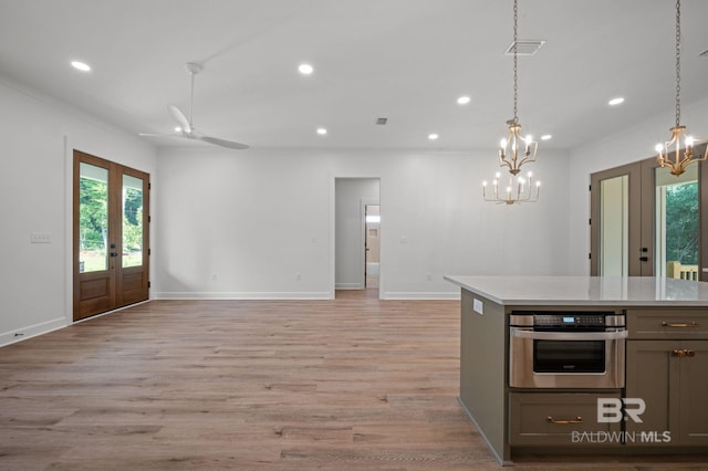 12380 Mannich Ln, Foley, AL 36580 - kitchen with french doors, oven, a chandelier, recessed lighting, and healthy amount of natural light