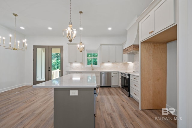 12380 Mannich Ln, Foley, AL 36580 - kitchen featuring stainless steel appliances, a chandelier, backsplash, a center island, and recessed lighting