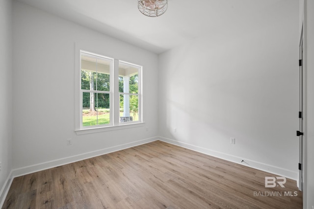 12380 Mannich Ln, Foley, AL 36580 - empty room featuring wood finished floors and baseboards