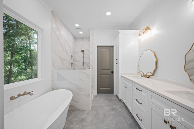 12380 Mannich Ln, Foley, AL 36580 - full bath with marble finish floors, plenty of natural light, a soaking tub, double vanity, and recessed lighting