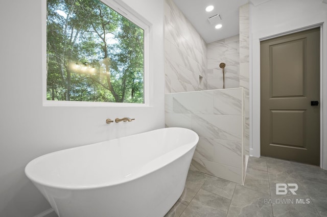 12380 Mannich Ln, Foley, AL 36580 - full bath featuring marble look tiles, a soaking tub, a tile shower, and recessed lighting