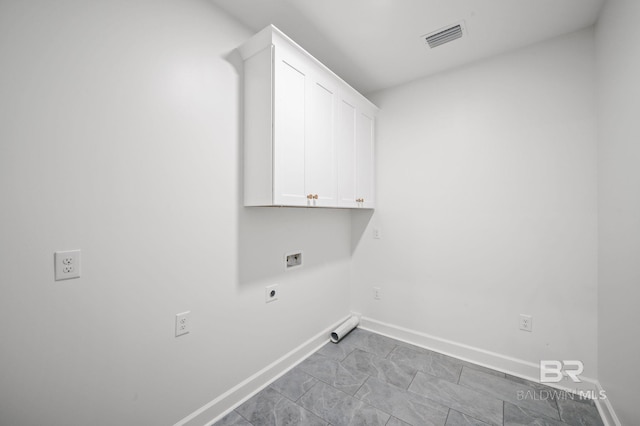 12380 Mannich Ln, Foley, AL 36580 - laundry room featuring cabinet space, hookup for an electric dryer, washer hookup, and baseboards