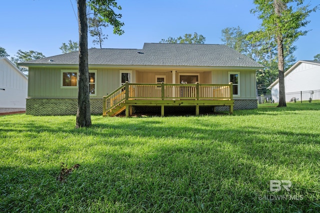 12380 Mannich Ln, Foley, AL 36580 - rear view of house with a wooden deck, roof with shingles, and board and batten siding
