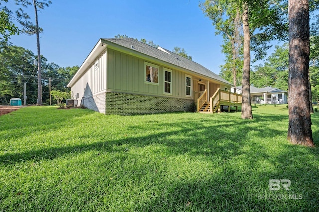 12380 Mannich Ln, Foley, AL 36580 - back of house featuring board and batten siding, brick siding, and a lawn
