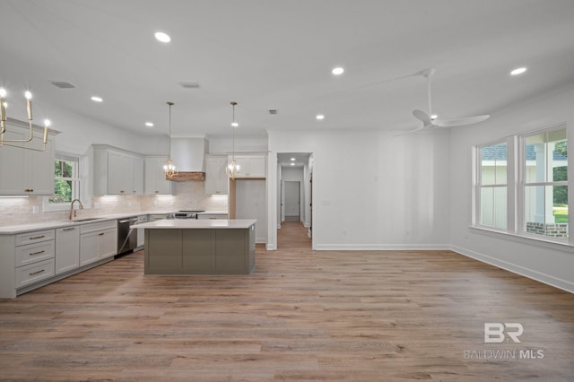 12380 Mannich Ln, Foley, AL 36580 - kitchen featuring appliances with stainless steel finishes, custom range hood, a sink, tasteful backsplash, and recessed lighting
