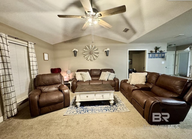 carpeted living room with lofted ceiling and ceiling fan