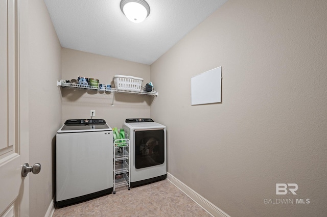 washroom with washer and clothes dryer