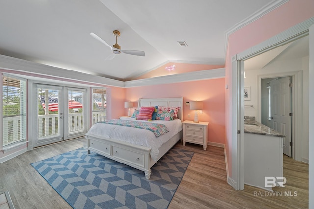 bedroom featuring access to exterior, vaulted ceiling, ceiling fan, and light wood-type flooring