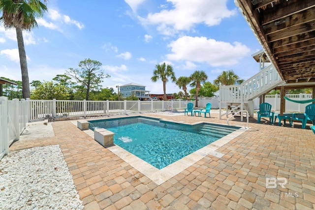 view of swimming pool with a patio area