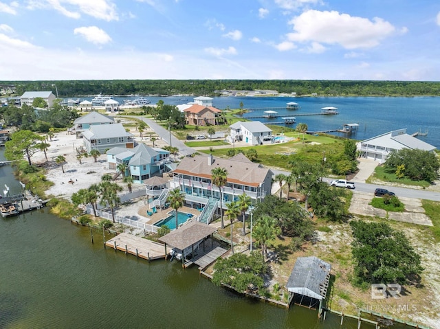 birds eye view of property with a water view