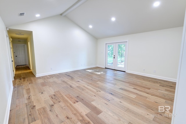 spare room with high vaulted ceiling, beamed ceiling, french doors, and light wood-type flooring