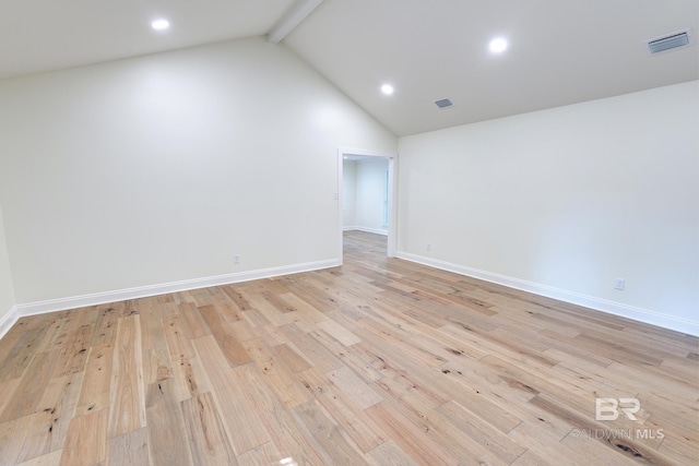 unfurnished room with beamed ceiling, light hardwood / wood-style floors, and high vaulted ceiling