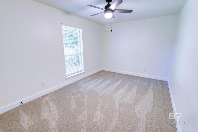 empty room with carpet flooring and ceiling fan