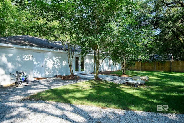 view of yard featuring french doors