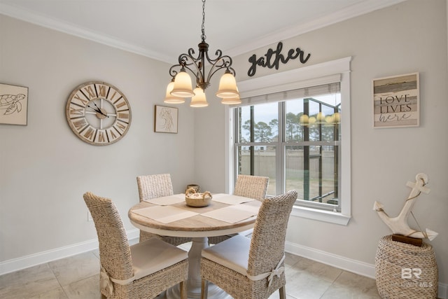 dining area featuring crown molding, plenty of natural light, and a notable chandelier