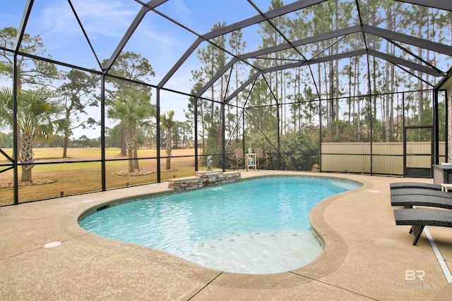 view of swimming pool featuring pool water feature, a lanai, and a patio area