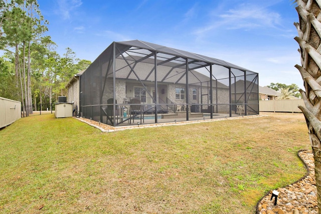 back of property featuring a yard and a lanai