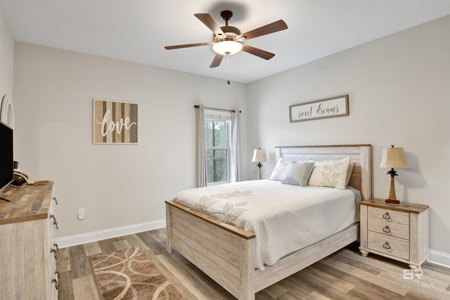 bedroom featuring wood-type flooring and ceiling fan