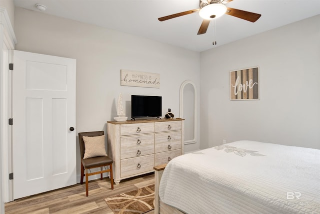 bedroom with ceiling fan and light hardwood / wood-style floors