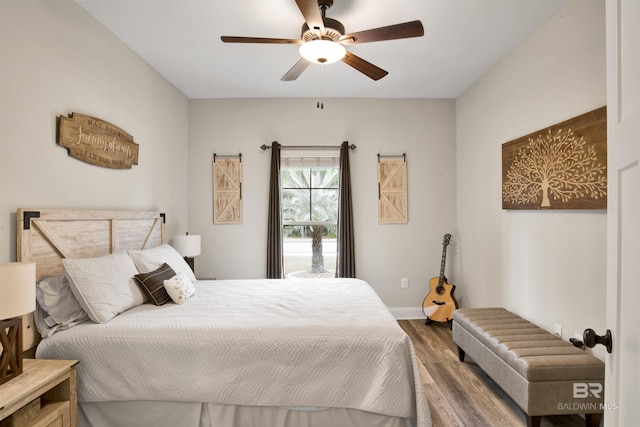 bedroom featuring ceiling fan and hardwood / wood-style floors