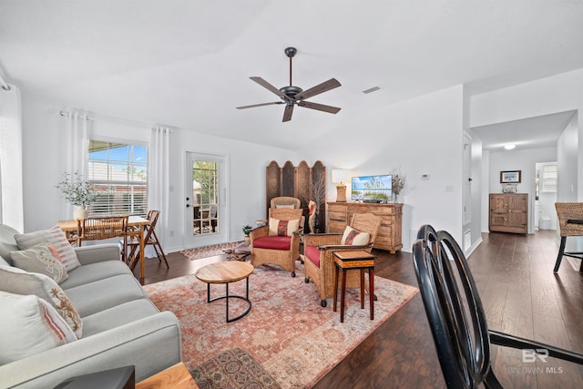 living room with lofted ceiling, dark hardwood / wood-style floors, and ceiling fan