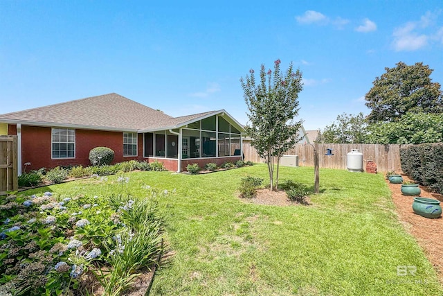 view of yard with a sunroom