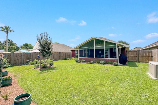 view of yard with a sunroom