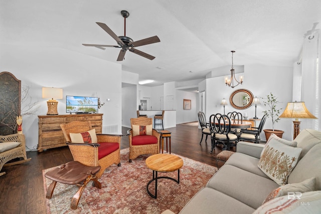 living room with lofted ceiling, dark hardwood / wood-style floors, and ceiling fan with notable chandelier