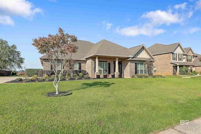 craftsman inspired home with a front lawn