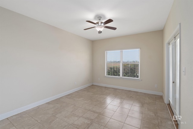 unfurnished room featuring ceiling fan and light tile patterned floors