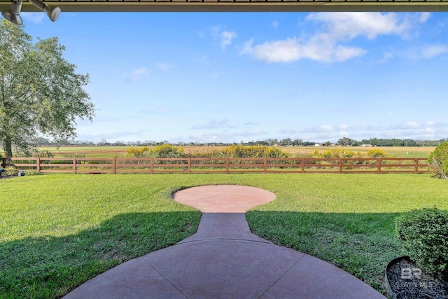 view of yard featuring a patio and a rural view