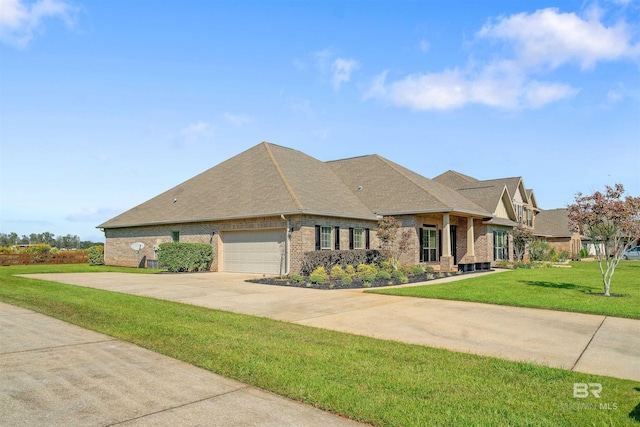 view of front of property featuring a garage and a front lawn