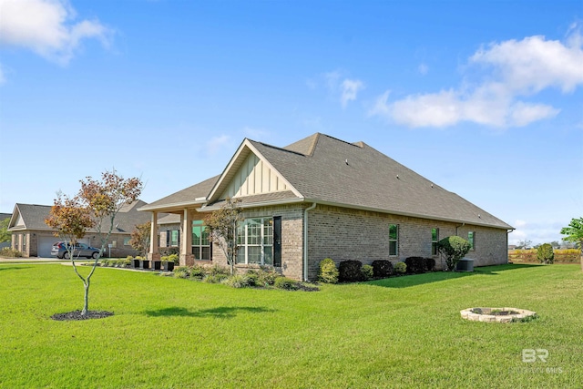 view of side of property with a lawn