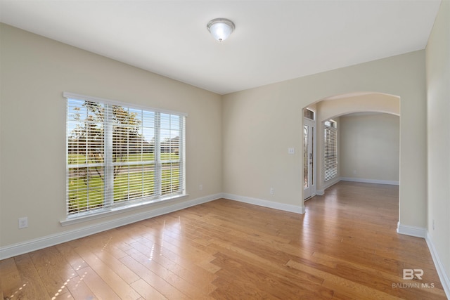 empty room with light hardwood / wood-style floors