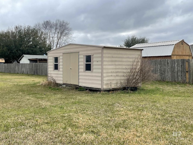 view of shed featuring fence